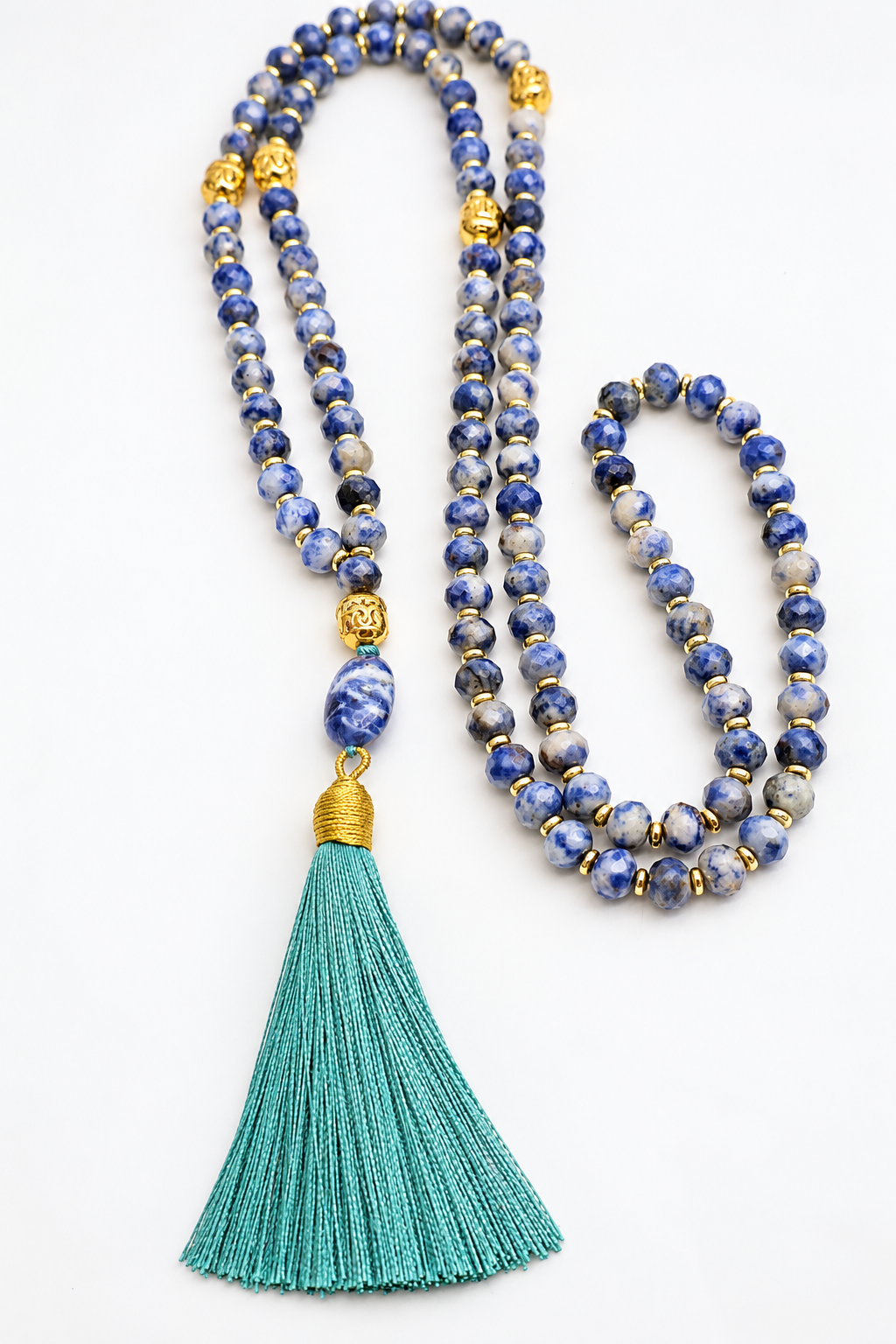 Mala Namtso in sodalite naturale con 108 grani, rondelle sfaccettate 8x6 mm, ematite dorata, elemento ovale finale in sodalite e nappina turchese