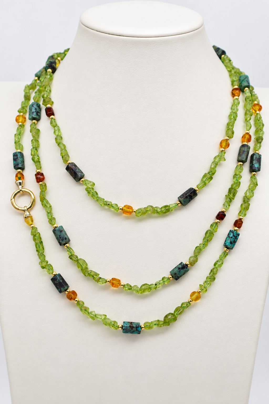 Collana Prestige in pietre naturali autentiche, peridoto, ambra baltica e turchese africano