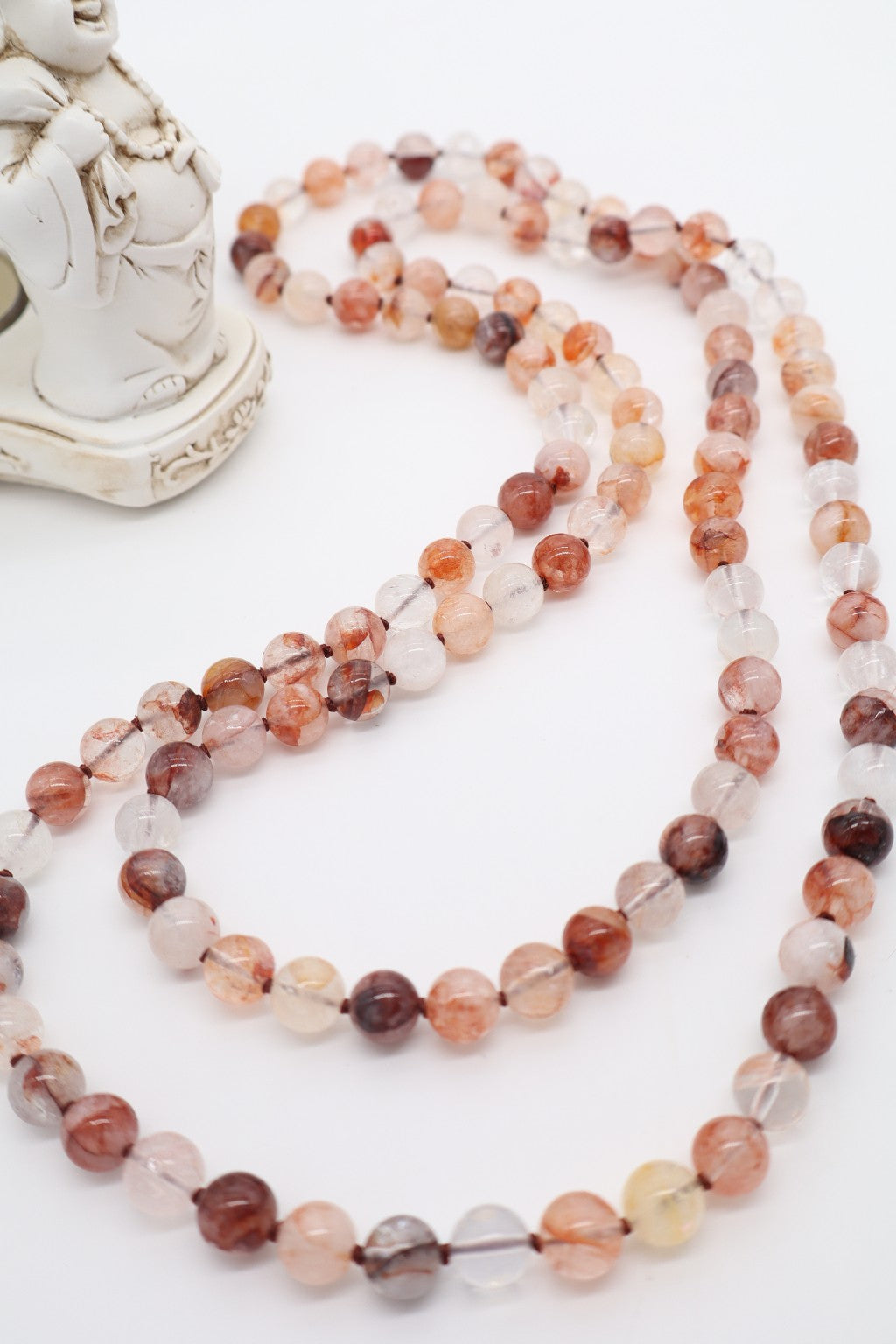 Collana lunga in quarzo ematoide naturale inclusioni e variazioni cromatiche naturali.