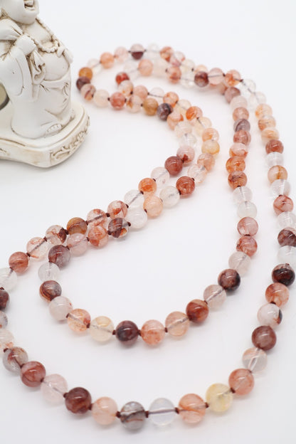 Collana lunga in quarzo ematoide naturale inclusioni e variazioni cromatiche naturali.
