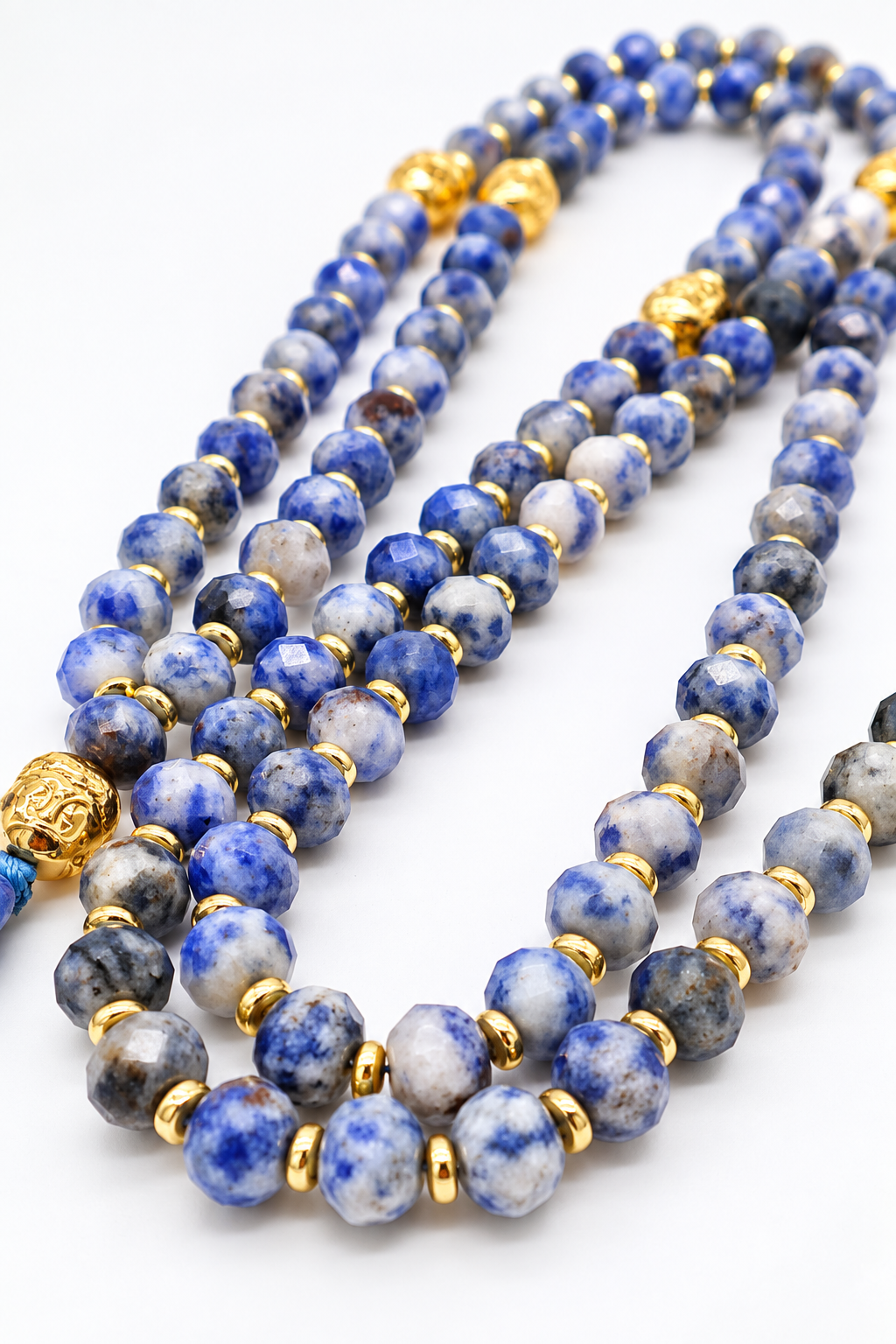 Mala Namtso in sodalite naturale con 108 grani, rondelle sfaccettate 8x6 mm, ematite dorata, elemento ovale finale in sodalite e nappina turchese
